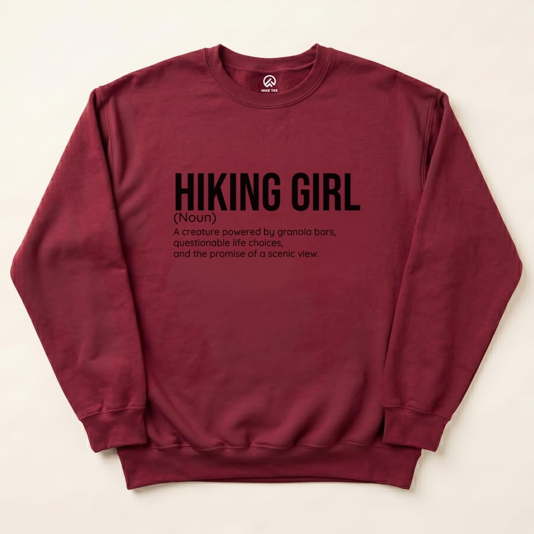 A burgundy "Hiking Girl Definition Sweatshirt" featuring a humorous definition of a hiking girl in bold black text.
