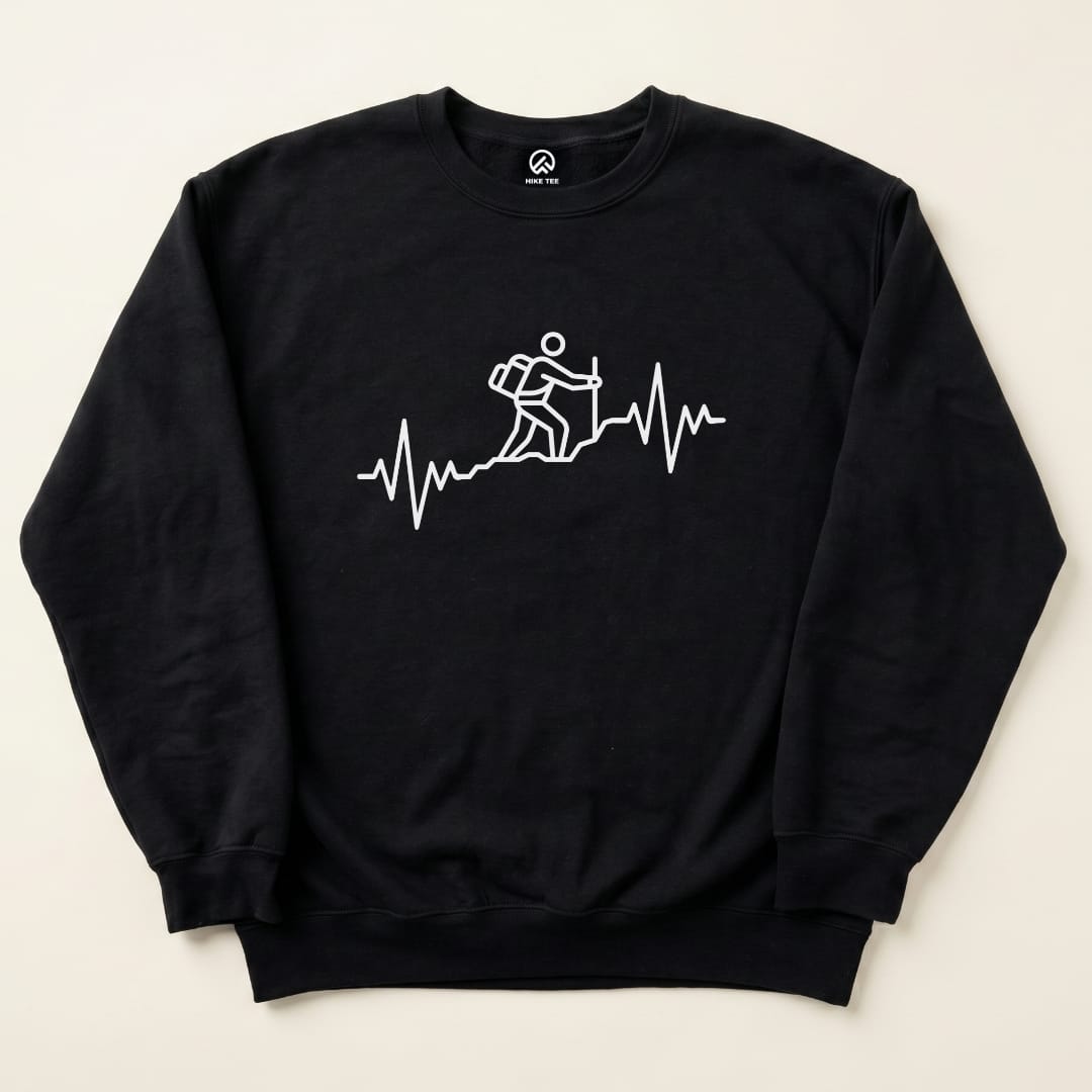 A black "Hiking Heart Rate Sweatshirt" displays a white graphic of a hiker on a mountain with a heartbeat line underneath.