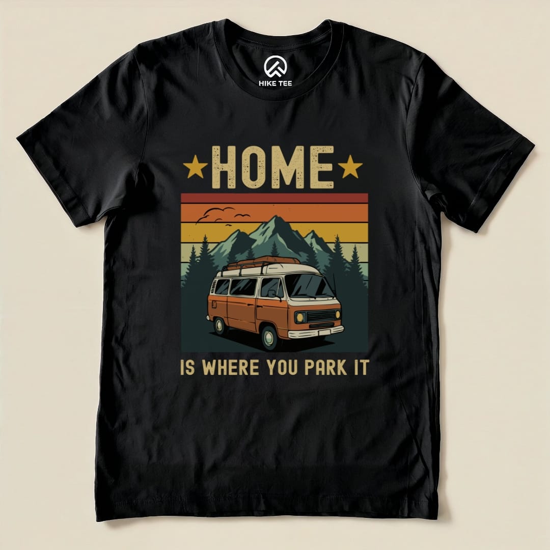 The graphic t-shirt features the phrase "Home Is Where You Park It" with an orange camper van set against a mountain backdrop.