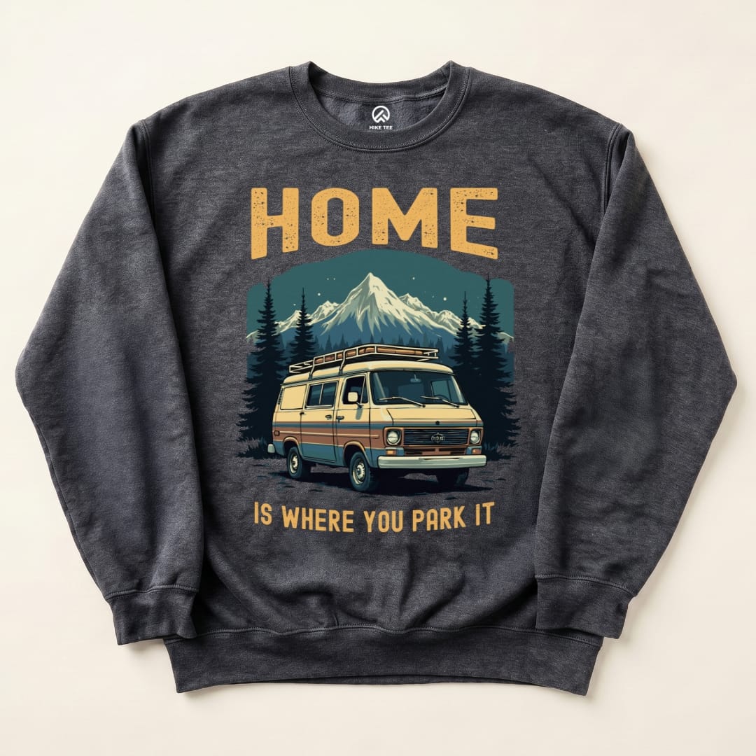 The Home Parked Sweatshirt features a vintage van in front of mountains with the slogan "HOME IS WHERE YOU PARK IT.