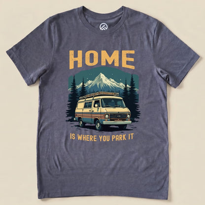 Graphic t-shirt featuring a vintage camper van and mountains with the text "HOME IS WHERE YOU PARK IT" printed on it.