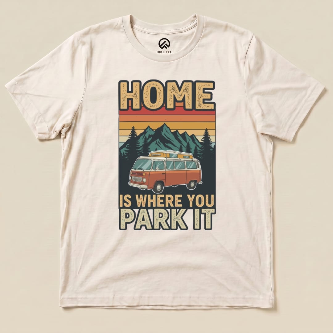 The "Home You Park It Shirt" features a vintage camper van graphic with the slogan, "Home is Where You Park It," on a light background.