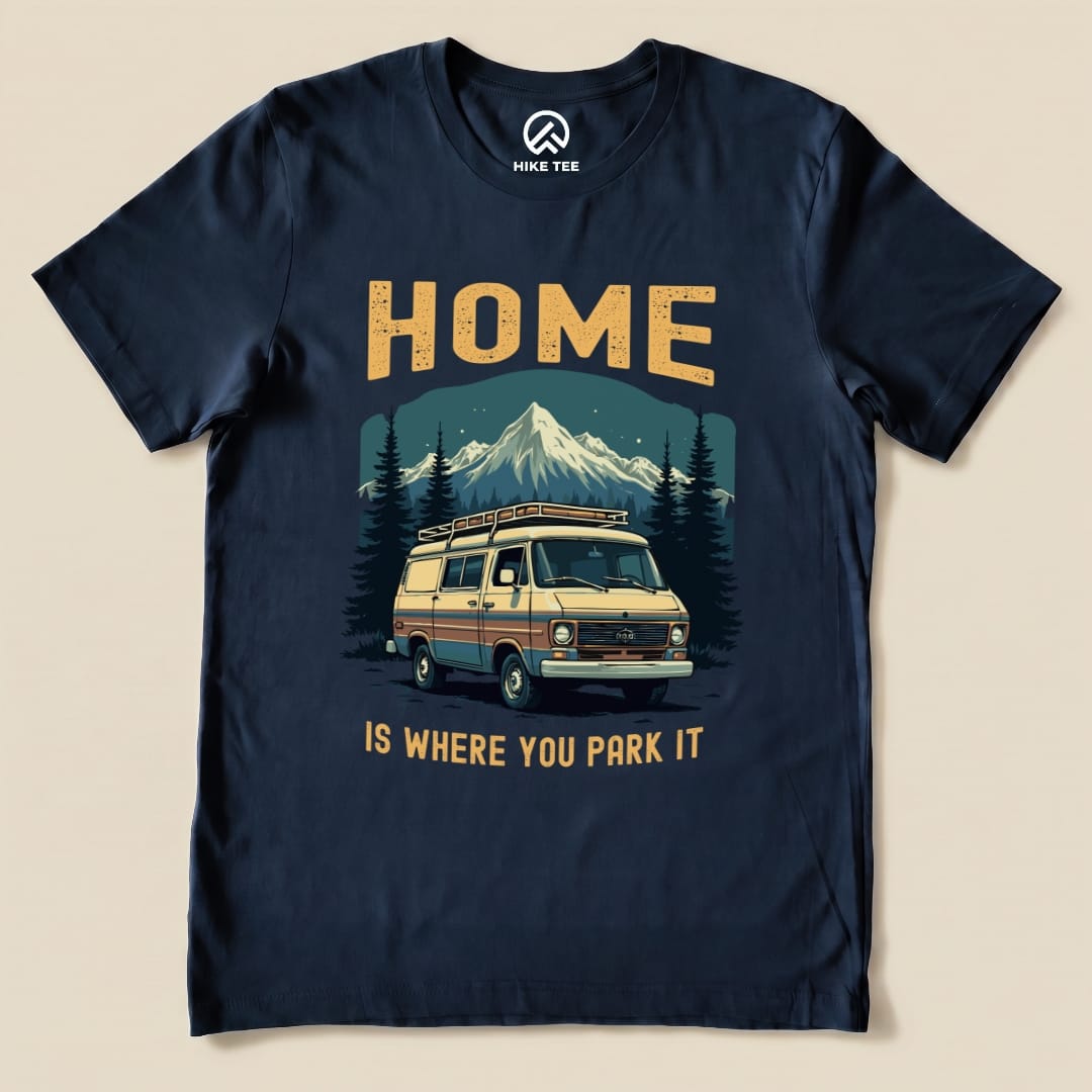 The "Home You Park It Shirt" features a vintage camper van graphic with mountains, trees, and the slogan "HOME IS WHERE YOU PARK IT.