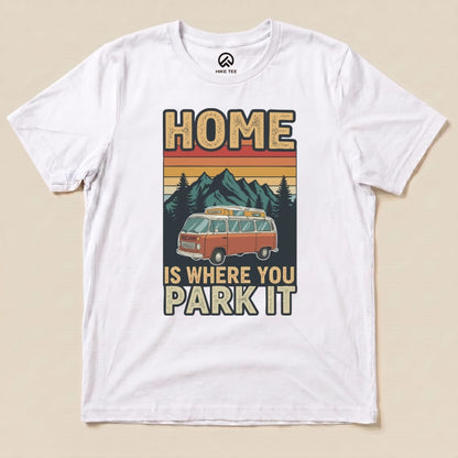 Graphic t-shirt featuring a vintage orange van set against mountains and trees, with the text "HOME IS WHERE YOU PARK IT.