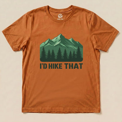 Graphic t-shirt in orange featuring a green mountain design with the text "I'D HIKE THAT" prominently displayed below.