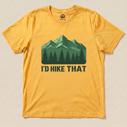 A yellow graphic t-shirt features a design with green mountains and trees along with the text "I'D HIKE THAT" prominently displayed.