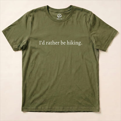 An olive green graphic t-shirt featuring the slogan "I’d rather be hiking." prominently displayed in white text.