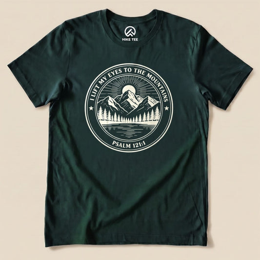 Graphic t-shirt featuring the design "I Lift My Eyes to the Mountains" with a mountain scene and the text "Psalm 121:1" printed.