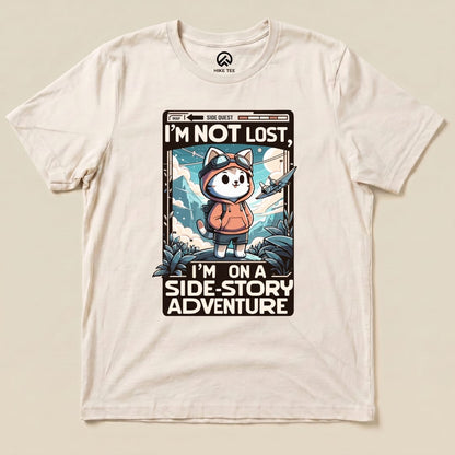 The "I'm Not Lost Cat Shirt" features a cute cat in a hoodie with the text "I'M NOT LOST, I'M ON A SIDE-STORY ADVENTURE" and vibrant outdoor elements.