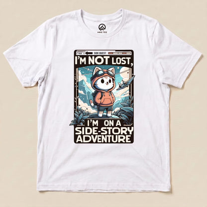 Graphic t-shirt featuring a playful cartoon design of a cat in a hoodie with text that says, "I'm Not Lost, I'm on a Side-Story Adventure.