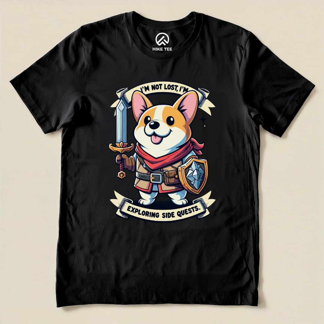 A graphic t-shirt featuring a cheerful corgi holding a sword and shield with the text "I'm Not Lost, I'm Exploring Side Quests.