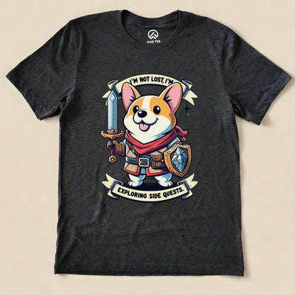 A graphic t-shirt features a cheerful corgi in a fantasy outfit holding a sword and shield, with the words "I'm Not Lost, I'm Exploring Side Quests.