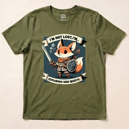 Graphic t-shirt featuring a playful fox with a sword and shield, printed with "I'm Not Lost, I'm... Exploring Side Quests.