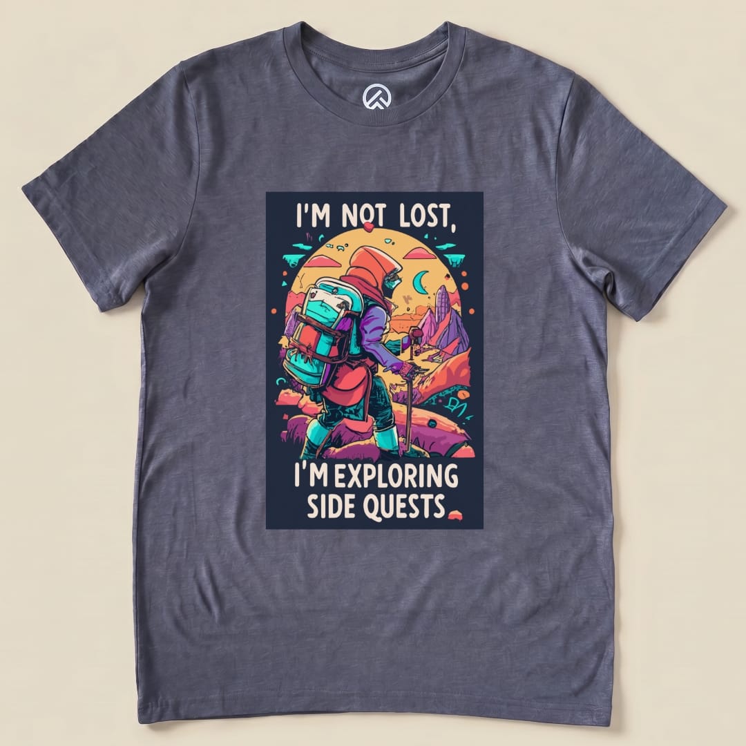 A graphic t-shirt featuring the phrase "I'm Not Lost, I'm Exploring Side Quests" alongside an illustrated hiker with a backpack.