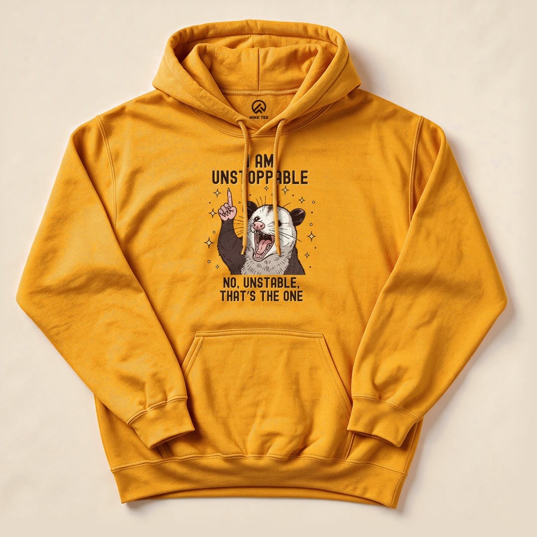 Gold I'm Unstoppable Possum Hoodie with a screaming possum "I Am Unstoppable - No, Unstable" graphic