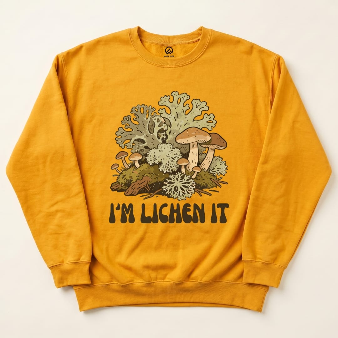 This graphic sweatshirt features a colorful design of mushrooms and lichen with the text "I'm Lichen It" prominently displayed.