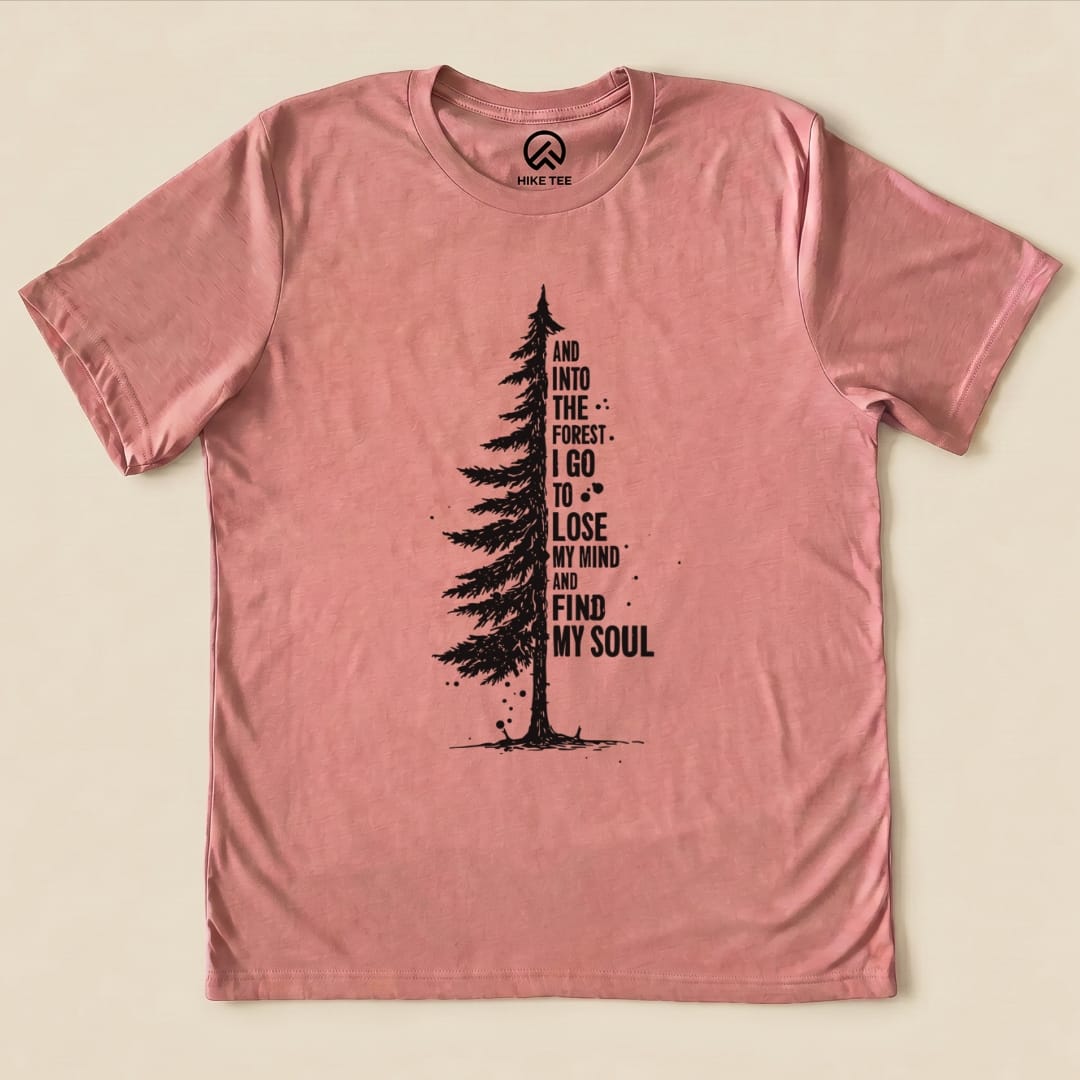 The "In The Forest Shirt" features a tall tree graphic alongside the phrase "And into the forest, I go to lose my mind and find my soul" on a pink background.