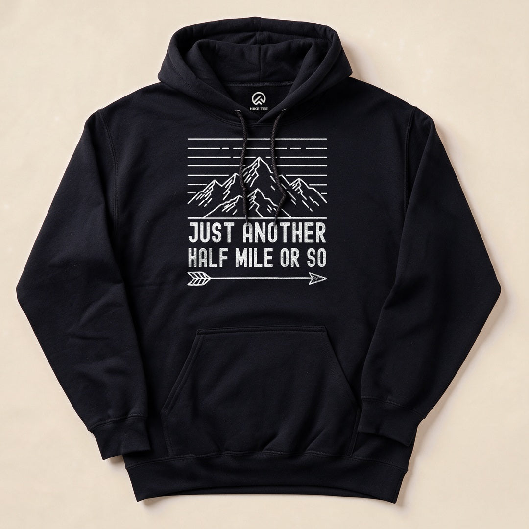 Black Just Another Half Mile Or So Hoodie with a retro mountain sunset graphic