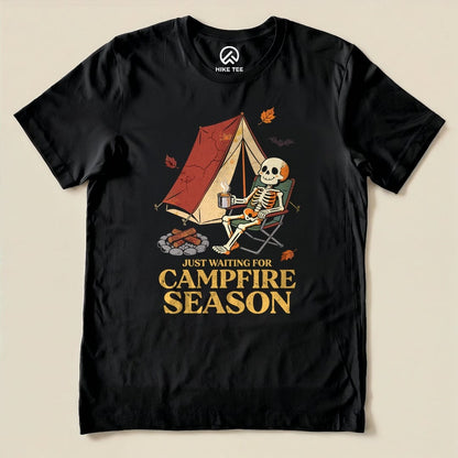 Black Just Waiting for Campfire Season Shirt with a skeleton in a camp chair by a tent graphic