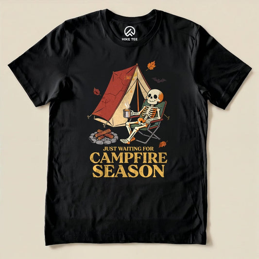 Black Just Waiting for Campfire Season Shirt with a skeleton in a camp chair by a tent graphic