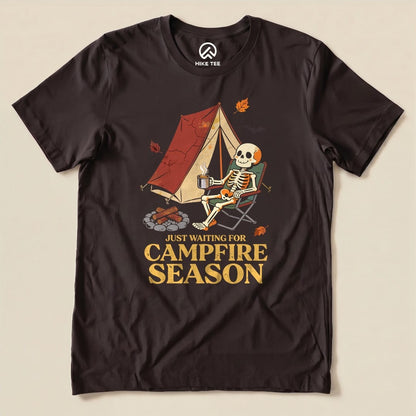 Brown Just Waiting for Campfire Season Shirt with a skeleton in a camp chair by a tent graphic