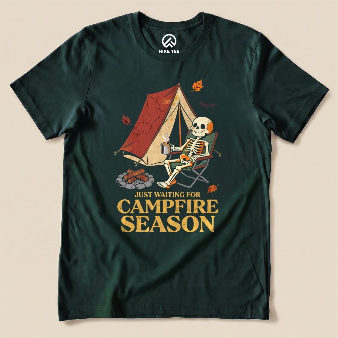 Forest Just Waiting for Campfire Season Shirt with a skeleton in a camp chair by a tent graphic