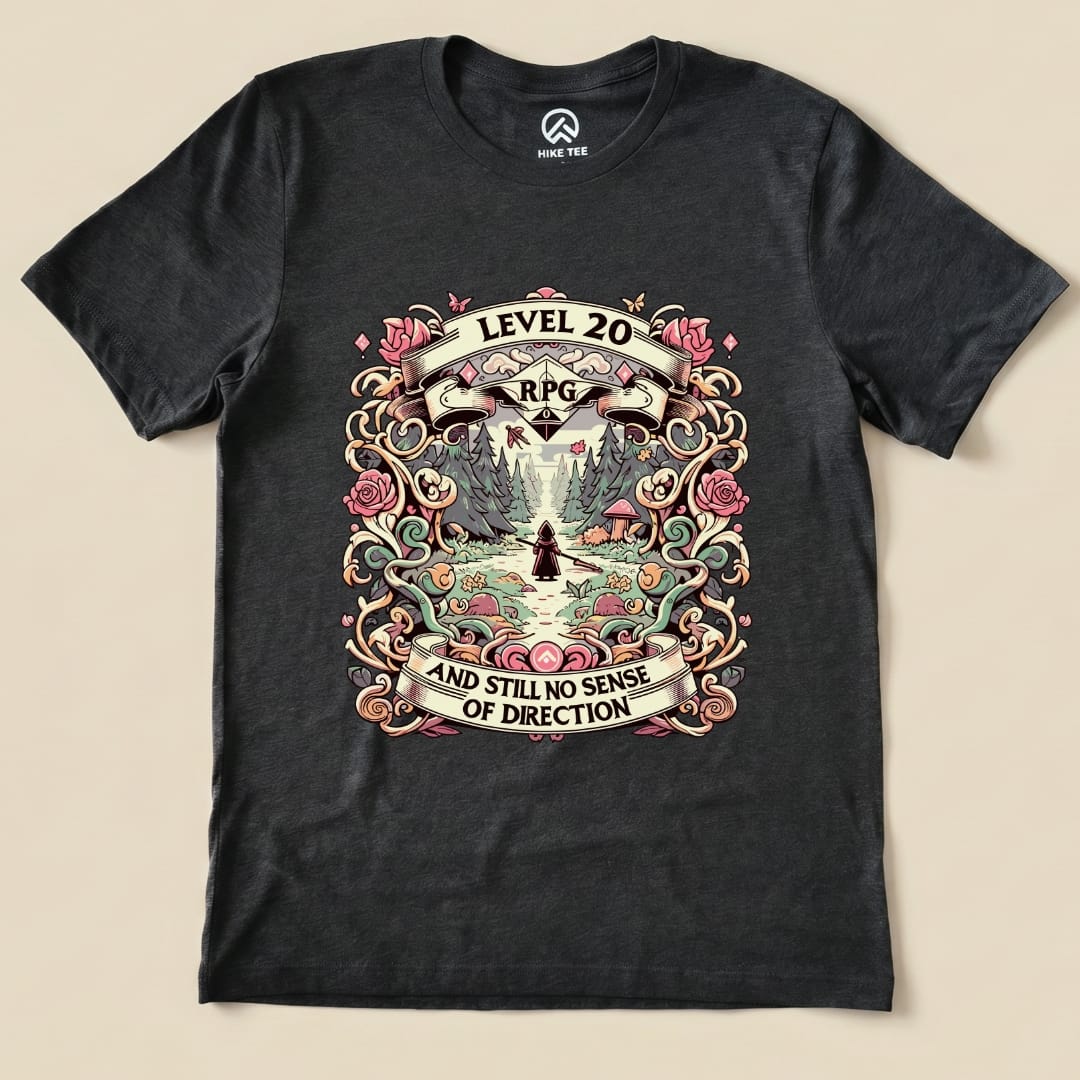 A graphic t-shirt featuring the design "Level 20 RPG" with the slogan "AND STILL NO SENSE OF DIRECTION" surrounded by colorful floral elements.