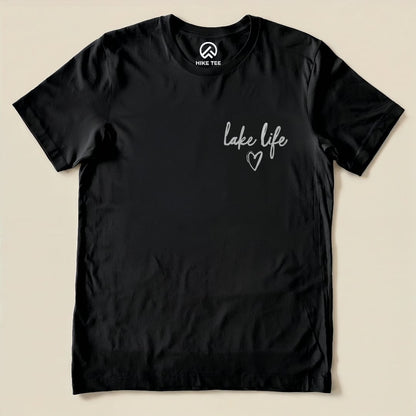 The "Like Life Shirt" features a simple design with the words "lake life" and a heart printed in a light color on a black graphic t-shirt.