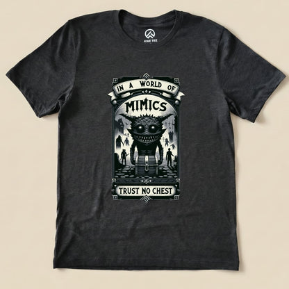 The graphic t-shirt features a bold design with the words "In a World of Mimics" and "Trust No Chest" above an illustrated creature.