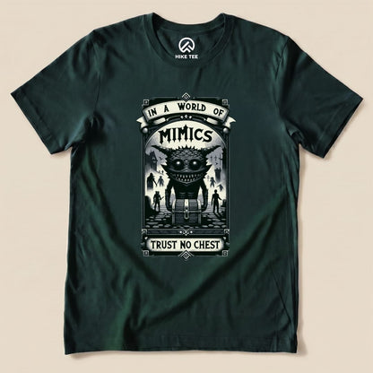 A graphic t-shirt featuring the "Mimics Shirt" design with a quirky monster and the phrase “Trust No Chest” on a dark background.