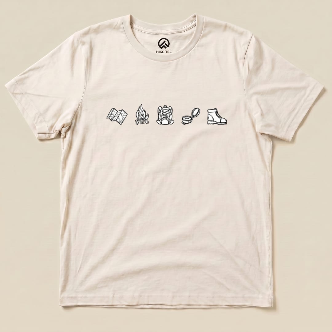 A minimalistic drawing hiking shirt featuring simple icons of a map, campfire, backpack, food, compass, and hiking boot.