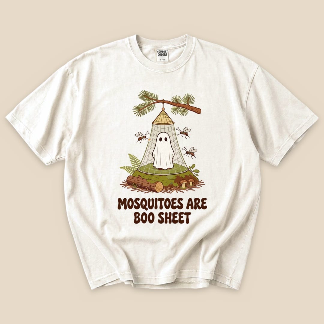 The graphic t-shirt features a playful design of a ghost in a net surrounded by mosquitoes, with the phrase "Mosquitoes Are Boo Sheet" prominently displayed.
