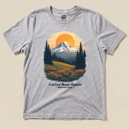 The graphic t-shirt features a vibrant print of Mount Rainier at sunset with the text "I visited Mount Rainier National Park.