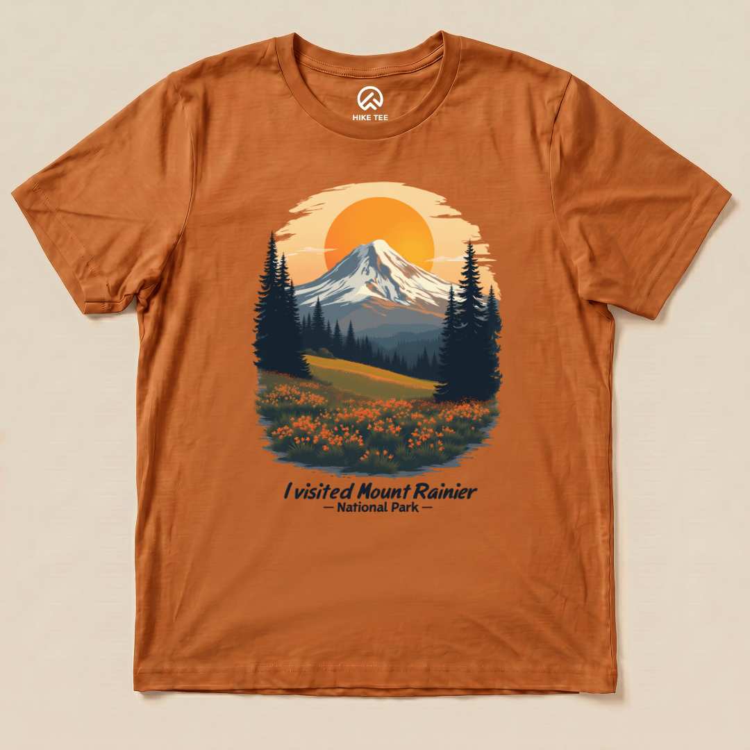 A graphic t-shirt features a scenic illustration of Mount Rainier with the slogan "I visited Mount Rainier National Park" below.