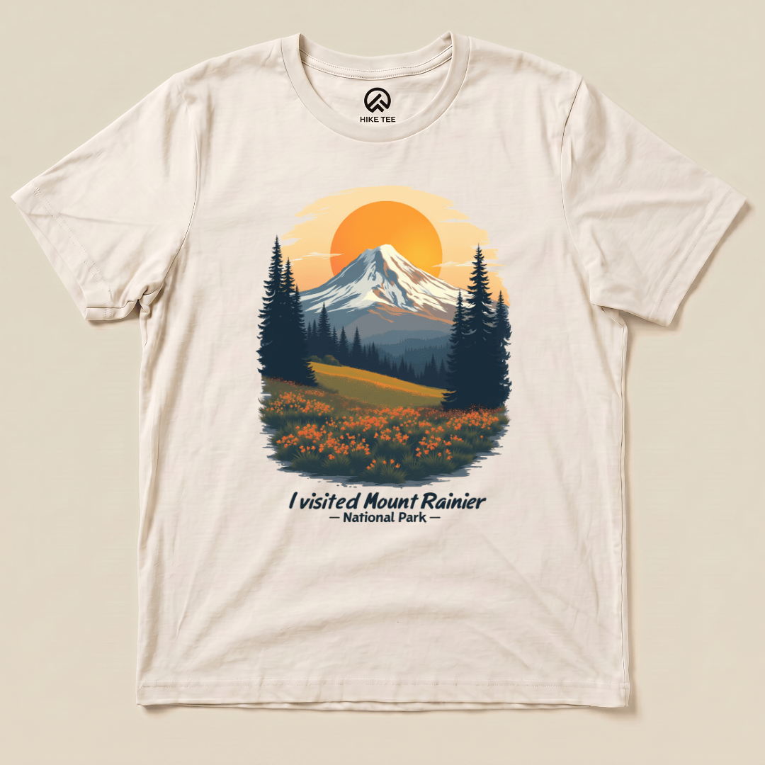 A graphic t-shirt featuring a scenic illustration of Mount Rainier with the text "I visited Mount Rainier National Park" below.