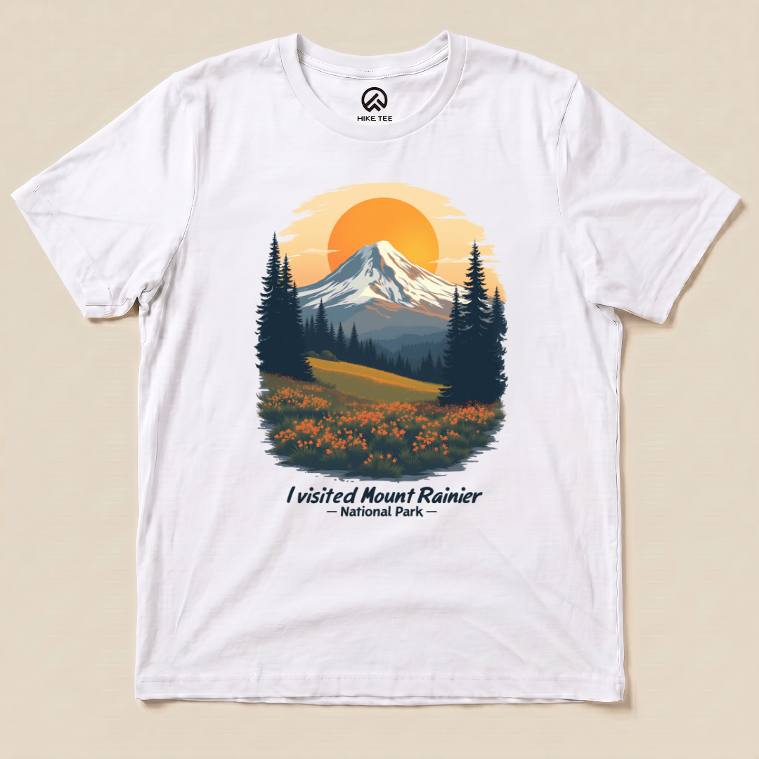 A graphic t-shirt featuring a colorful illustration of Mount Rainier and the phrase "I visited Mount Rainier National Park.