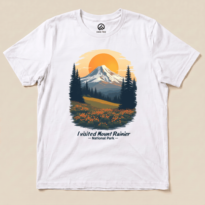 A graphic t-shirt featuring a colorful illustration of Mount Rainier and the phrase "I visited Mount Rainier National Park.