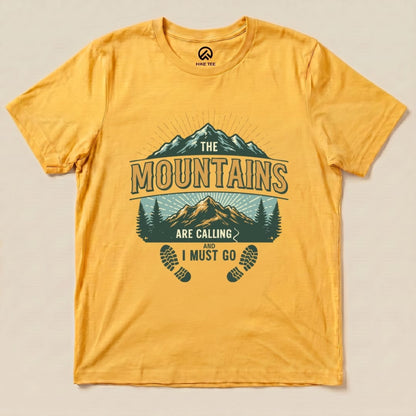 A vibrant yellow graphic t-shirt features the slogan "The Mountains are Calling and I Must Go" along with mountain and tree illustrations.