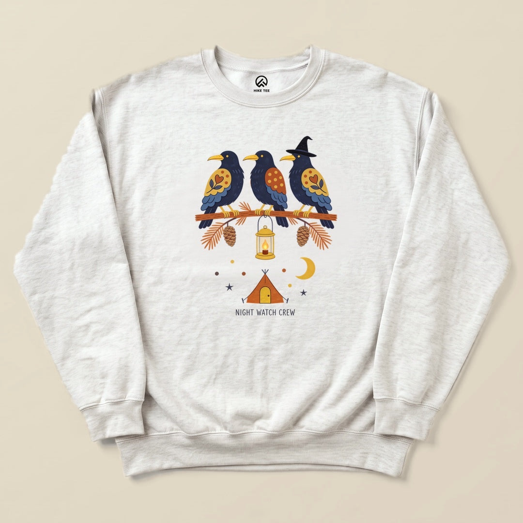 Ash Night Watch Crew Sweatshirt with a folk-art crow trio on a pine branch with a lantern above a tent graphic