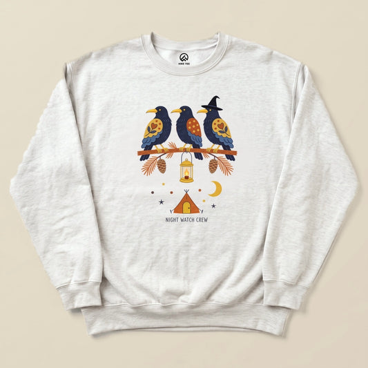 Ash Night Watch Crew Sweatshirt with a folk-art crow trio on a pine branch with a lantern above a tent graphic