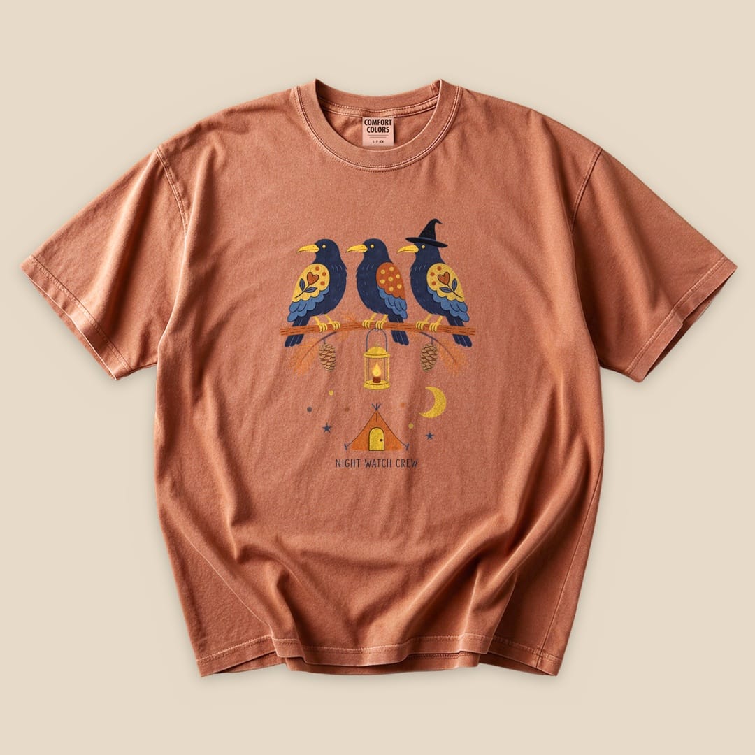 The "Night Watch Crew T-Shirt" features a colorful graphic of three birds on a branch with a tent and moon design.