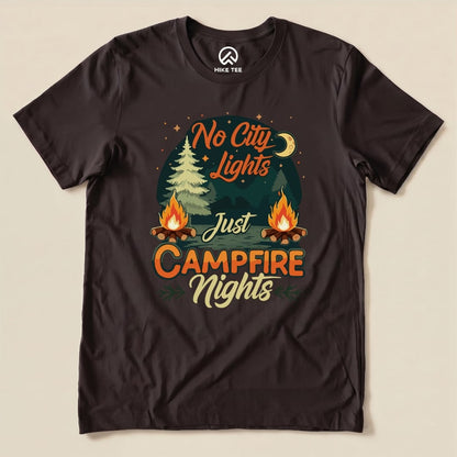 A black graphic t-shirt featuring the slogan "No City Lights Just Campfire Nights" with illustrations of trees and campfires.
