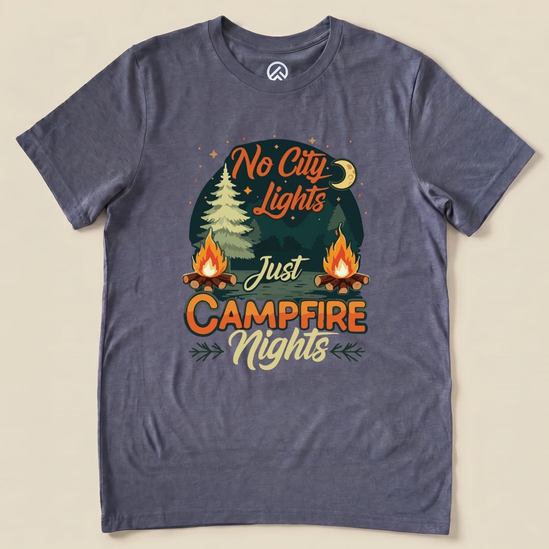 The "No City Lights Just Campfire Nights Shirt" features vibrant campfire graphics, a moon, and a pine tree against a dark blue background.
