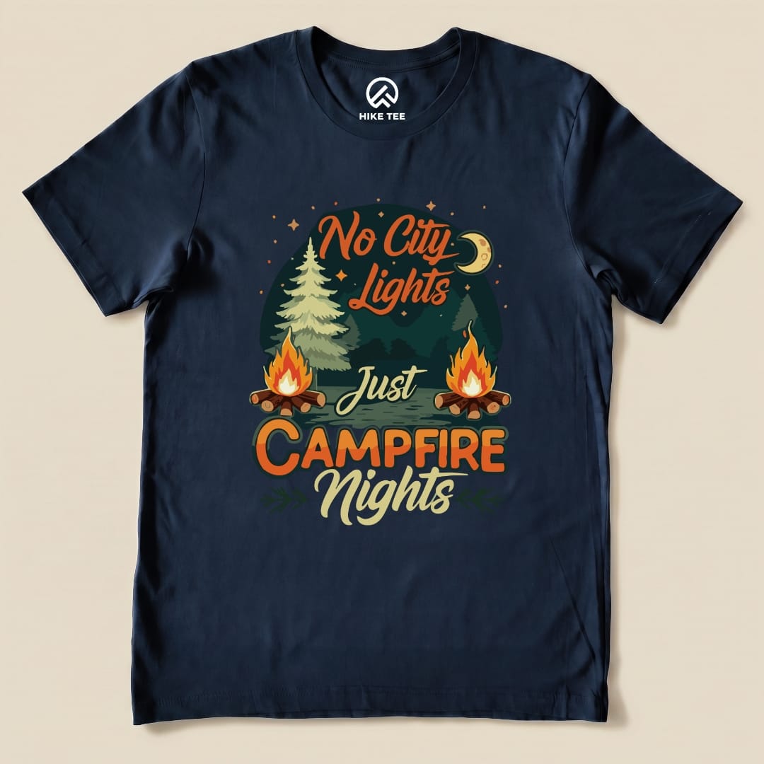 The graphic t-shirt features the phrase "No City Lights Just Campfire Nights" with illustrations of a moon, trees, and campfires.