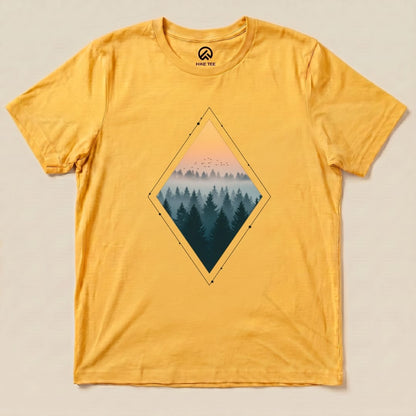 A yellow graphic t-shirt features a diamond-shaped design of a misty forest with a sunset, titled "Nostalgic Forest Shirt.
