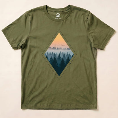 Graphic t-shirt in olive green featuring a diamond-shaped print of a misty forest at sunset, titled "Nostalgic Forest Shirt".