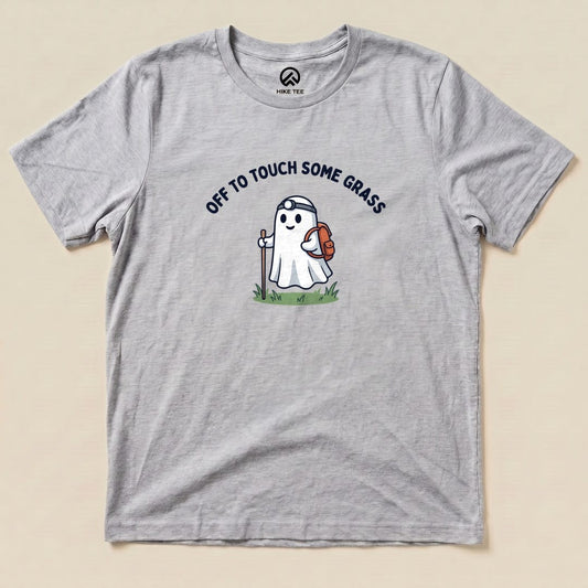 Athletic Heather Off to Touch Some Grass Shirt with a ghost hiker with a headlamp and backpack graphic
