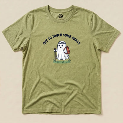 Heather Green Off to Touch Some Grass Shirt with a ghost hiker with a headlamp and backpack graphic