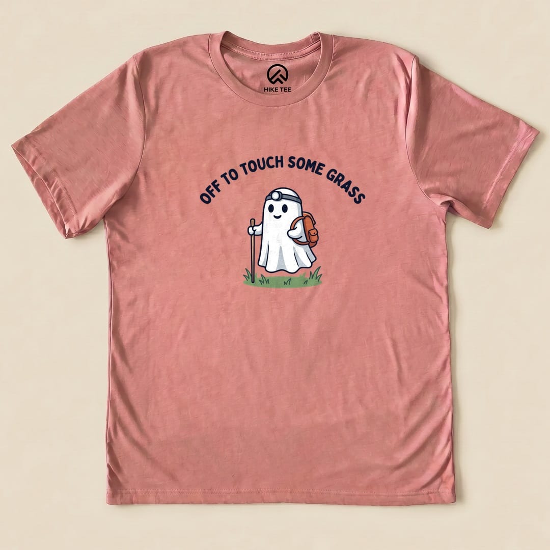 Heather Mauve Off to Touch Some Grass Shirt with a ghost hiker with a headlamp and backpack graphic
