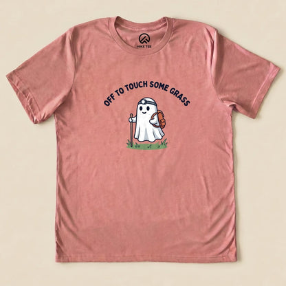 Heather Mauve Off to Touch Some Grass Shirt with a ghost hiker with a headlamp and backpack graphic